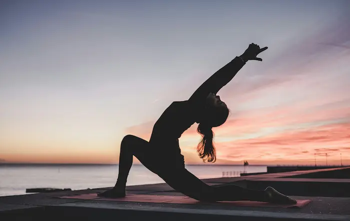 A serene pregnant woman practicing mindful breathing
