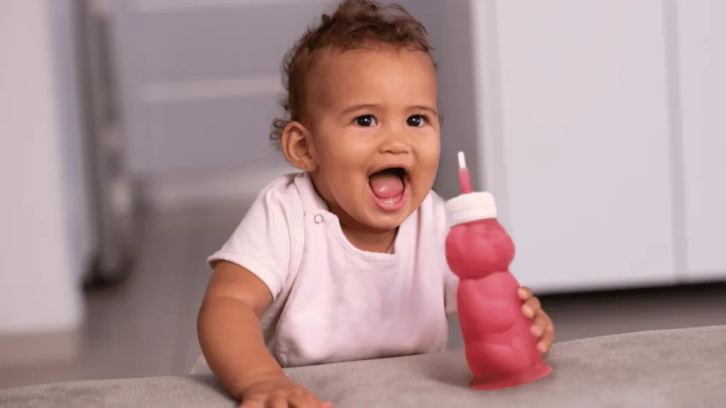 A gradual progression from assisted open cup to independent straw cup builds the strongest foundation for oral development
