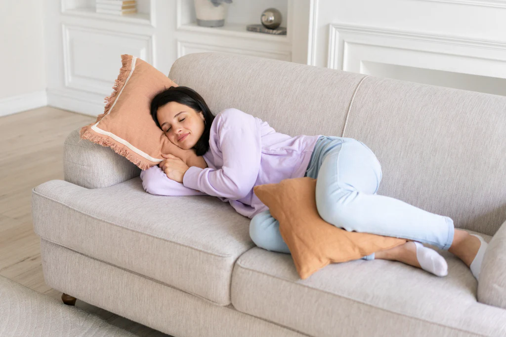 A person sitting comfortably on a sofa