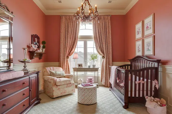 A serene corner of a small nursery with blackout curtains drawn
