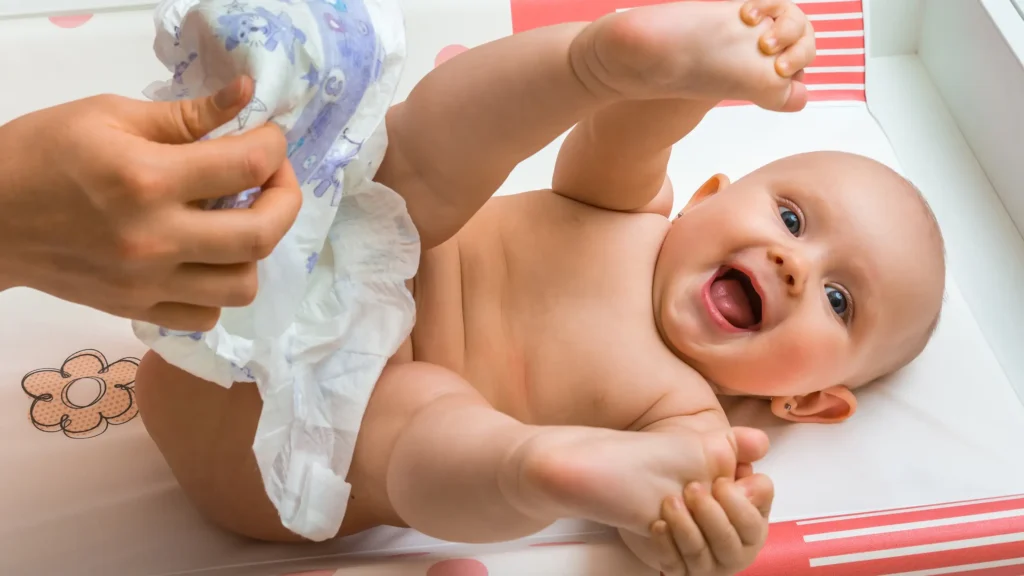  A simple, clear infographic showing the correct front-to-back wiping motion for baby girls