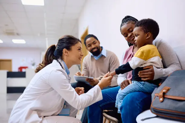 A warm, inviting photo of a pediatrician in an exam room