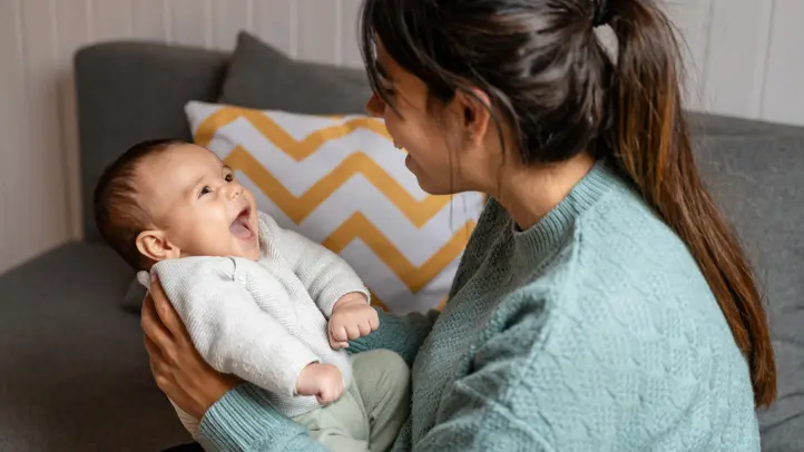 Face-to-face interaction using “parentese” captures a newborn’s attention and builds early communication pathways