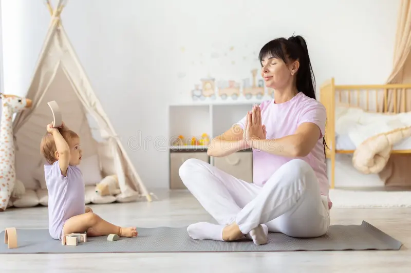 Image of a mother doing a short stretching routine while baby plays on a mat nearby