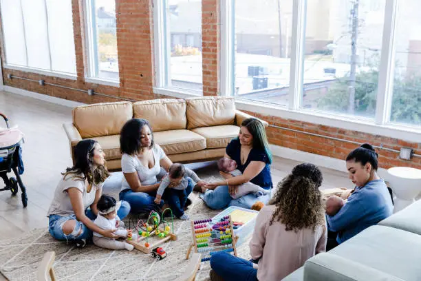 Image of a new moms support group meeting in a casual setting
