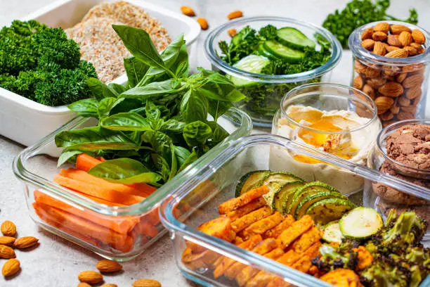 Image of healthy snacks prepped in containers on a kitchen counter