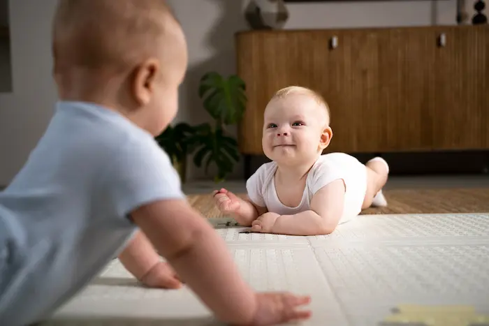 A baby doing tummy time, which supports motor and cognitive development