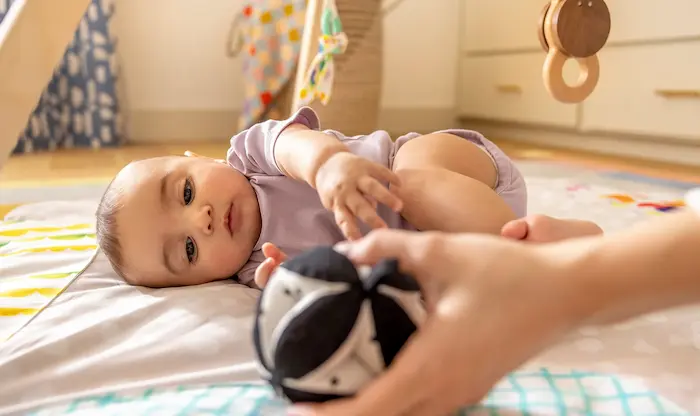 When Do Babies Roll Over? Supporting This Milestone