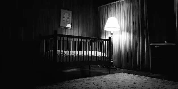 dark room with white noise machine crib